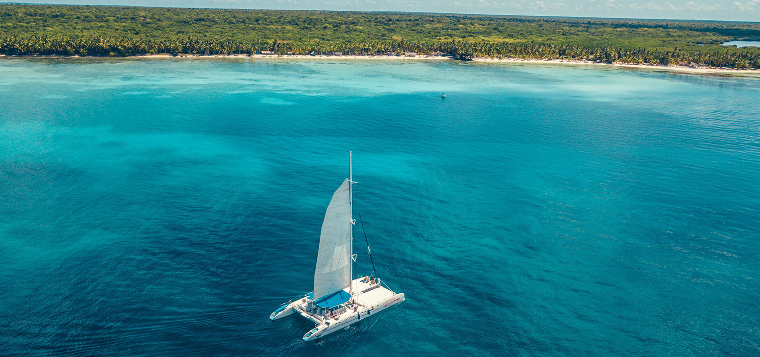 Boat in the caribbean sea with tropical water in dominican republic in paradise