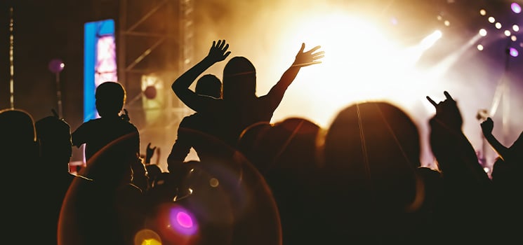 People dancing and having fun at outdoor summer festival
