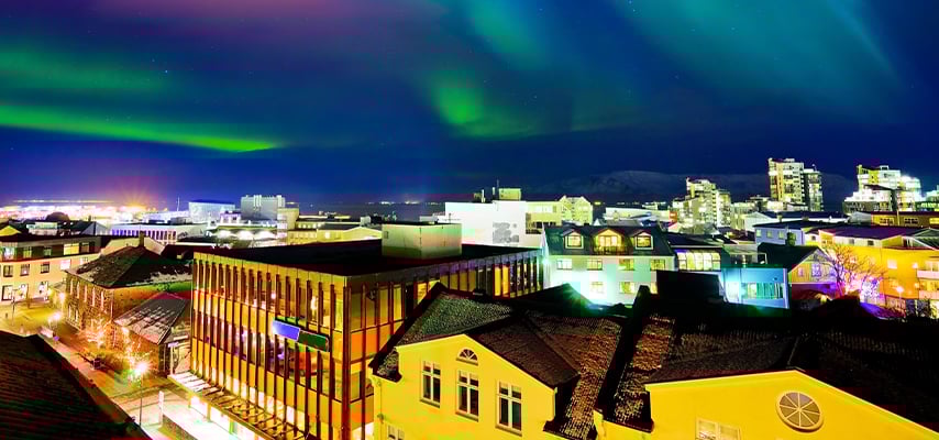 View of the northern light from the city center in Reykjavik, Iceland