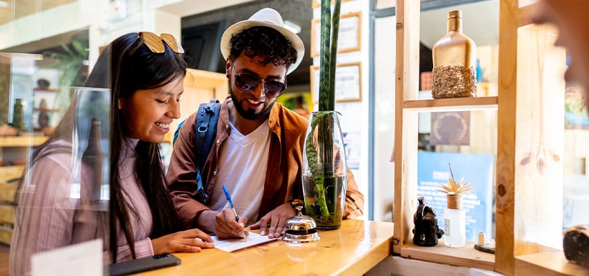 Young couple making a reservation on a hotel