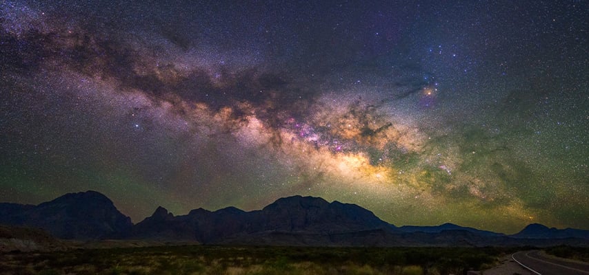 Milky Way arching over desert mountains at Big Bend