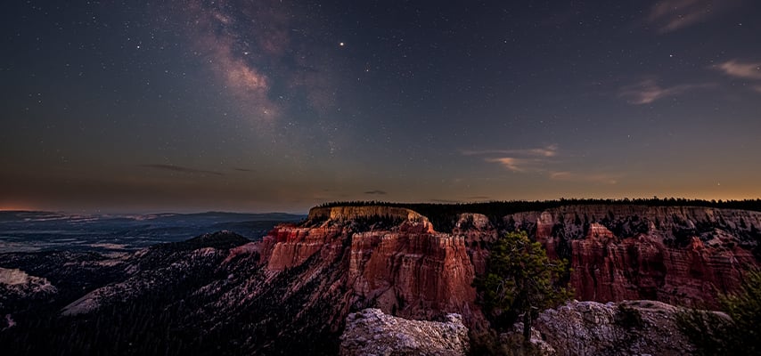 Milky Way above red rock formations at Bryce Canyon