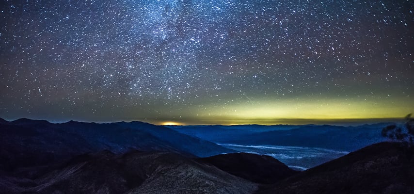 Starry sky over Death Valley mountains at night