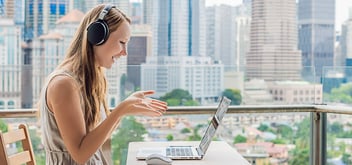 Young woman learns a foreign language on the Internet