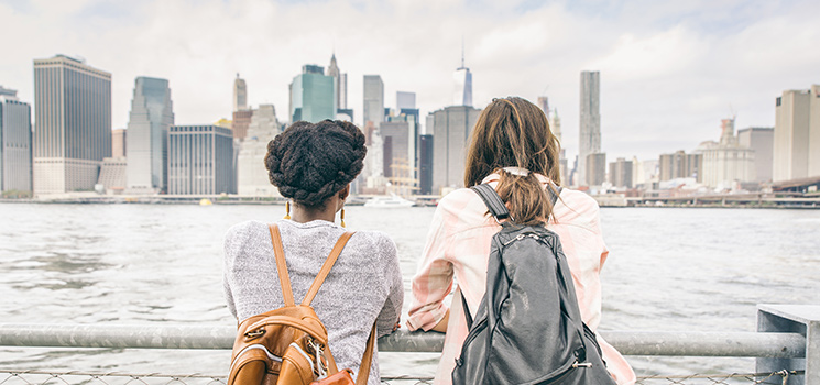 women looking at new york city skyline