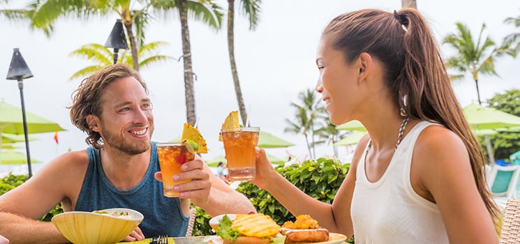 Couple eating at tropical restaurant on vacation